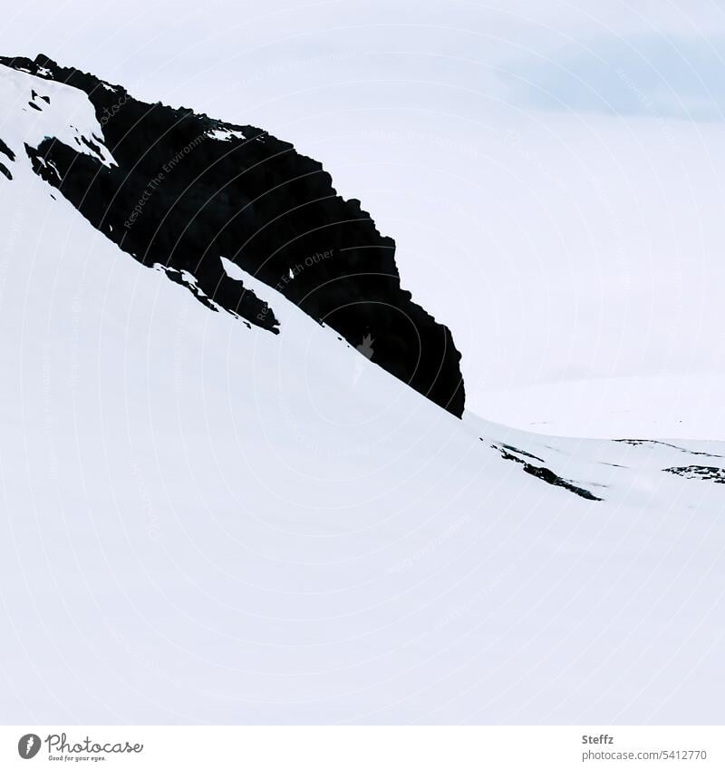 Snow and rocks on Iceland sometimes form bizarre shapes East Iceland Snow layer Iceland weather Rock snow-covered Icelandic silent snowy rocky Empty winter void