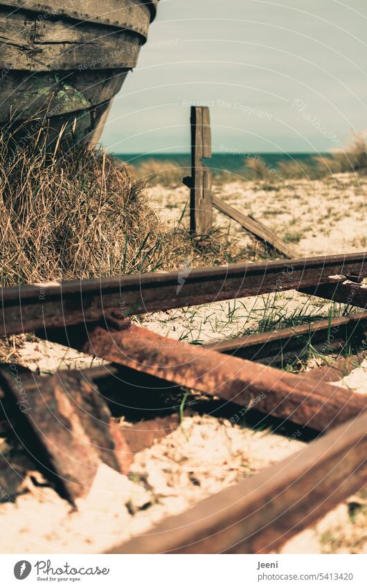 Shipwreck on the beach Wreck railway tracks corroded Beach Ocean Old lost places forsake sb./sth. Broken Sand duene Change Wood ship boat Decline Ruin