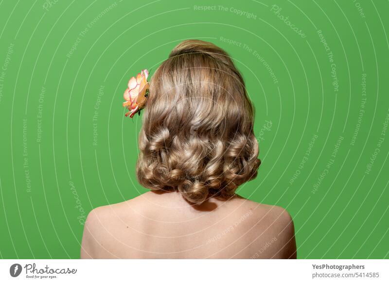 Portrait of a blonde woman with curly hair in retro style, isolated on a green background 40s 50s accessories beauty bright color concept copy space cute