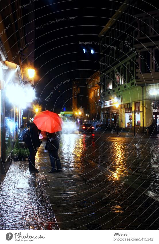 It is evening and it is raining in the old town, an umbrella is very useful there Rain Street Wet Umbrella Passers-by Old Historic Old town köpenick