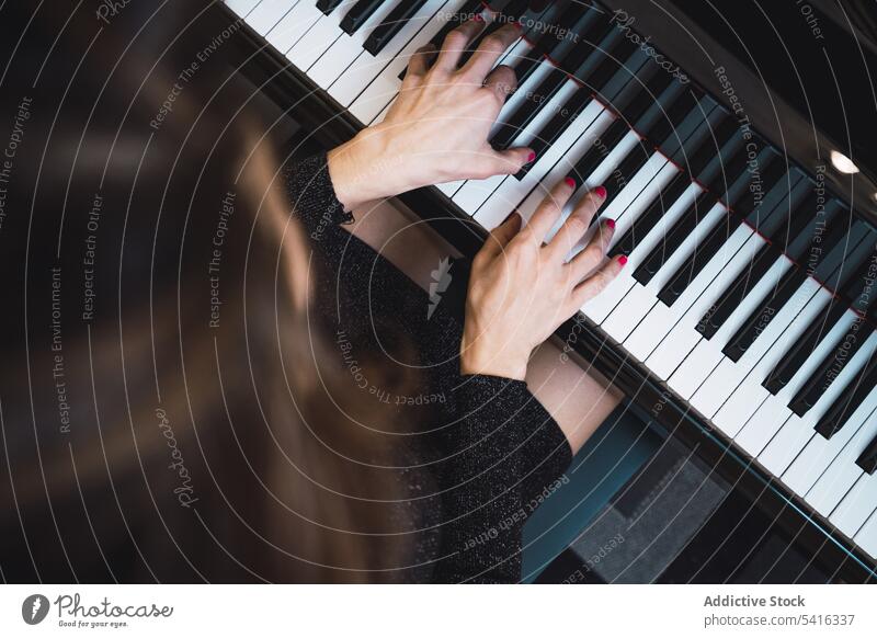 Top view of cropped hands playing the piano top view woman musician elegant room pianist instrument keyboard art sound performance melody classical harmony