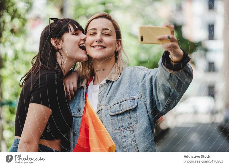 Happy lesbian couple taking selfie on street smartphone lgbt happy city young together women casual homosexual pride equality alternative relationship love