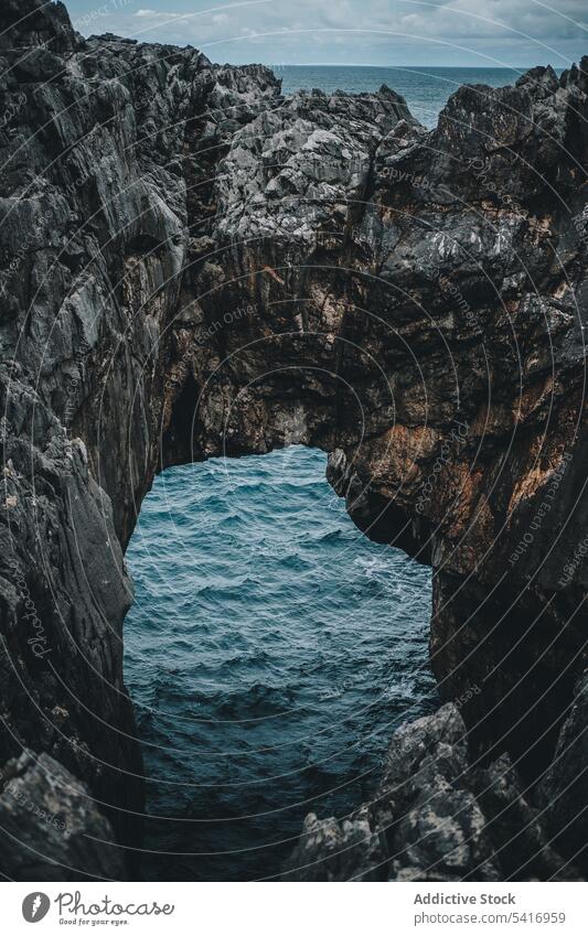 Picturesque rocks and sea cliff arch cave landscape natural passage water hole picturesque peaceful breathtaking tranquil calm idyllic scenic high beautiful