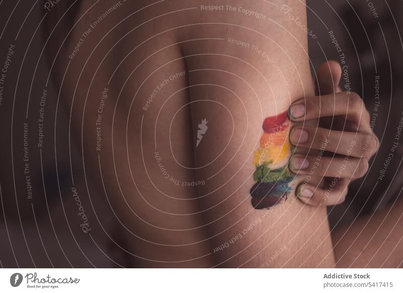 Attractive naked woman covering breast and drawing LGBT symbol beautiful lgbt sensual serious freedom equality rights female tolerance creative rainbow colorful