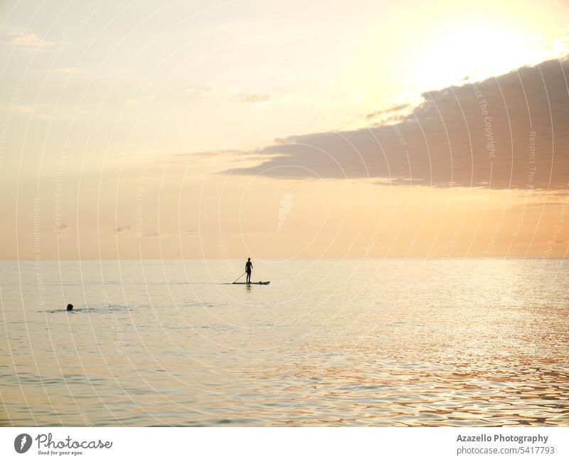 Seascape with a lonely human figure during the sunset. abstract active alone background beach beautiful beauty blue canada fun happy lake ontario landscape