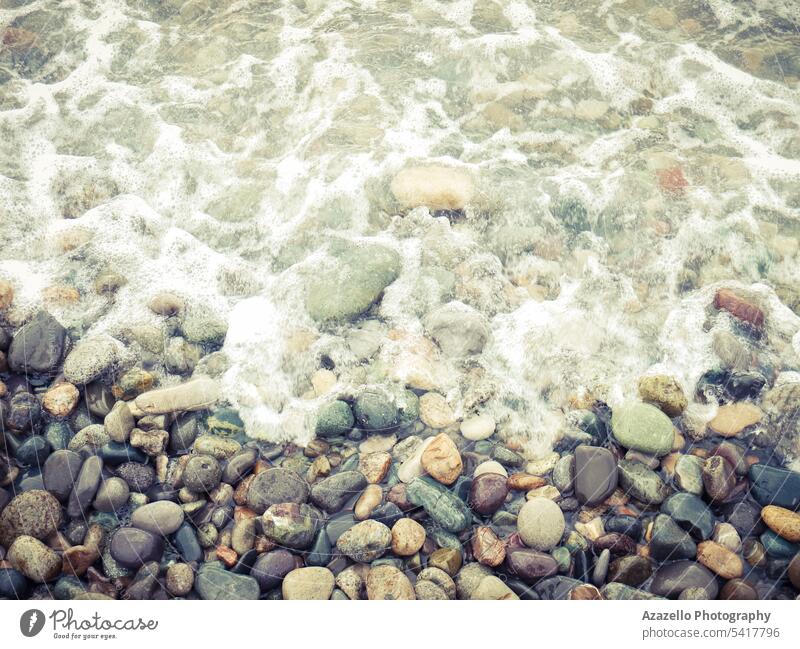 Seashore with pebbles and foam. abstract backdrop background beach beautiful closeup coast decoration ecologic environment holidays island landscape macro