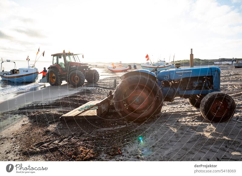 Tractor with fishing boat backlit on Vorupør beach in Denmark in sunrise II Sand Colour photo Relaxation Beach life Vacation & Travel bathe Recreation area