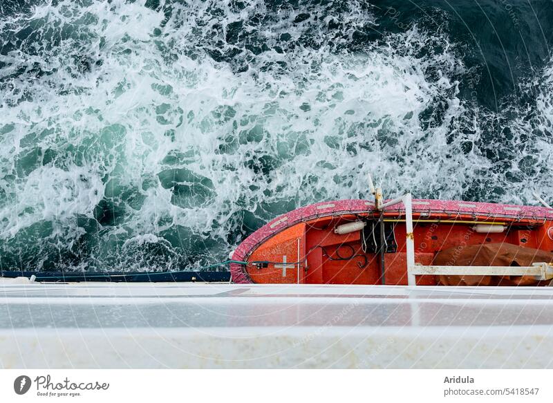 Bird's eye view of the Baltic Sea and an orange lifeboat hanging from a white ferry Swell Crossing Ferry Lifeboat Sea rescue Navigation Ocean Vacation & Travel