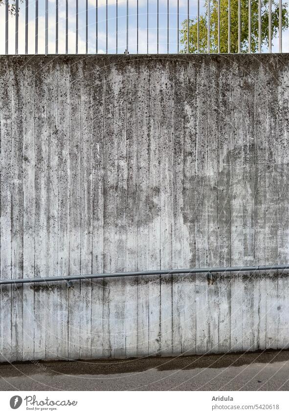 High concrete wall of an underpass with railing Concrete Wall (building) Concrete wall Underpass handrail Gray Blue sky Wall (barrier) Architecture