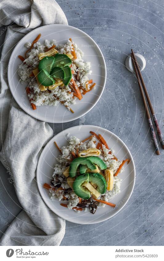 Crumbly rice with vegetables on linen with spoon on table cuisine national dish fresh asian food delicacy sushi wooden gourmet appetizer delicious traditional