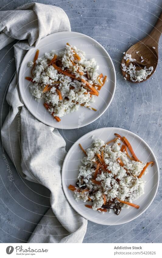 Tasty crumbly rice with vegetables on linen with spoon on table cuisine national dish fresh asian food delicacy sushi wooden gourmet appetizer delicious