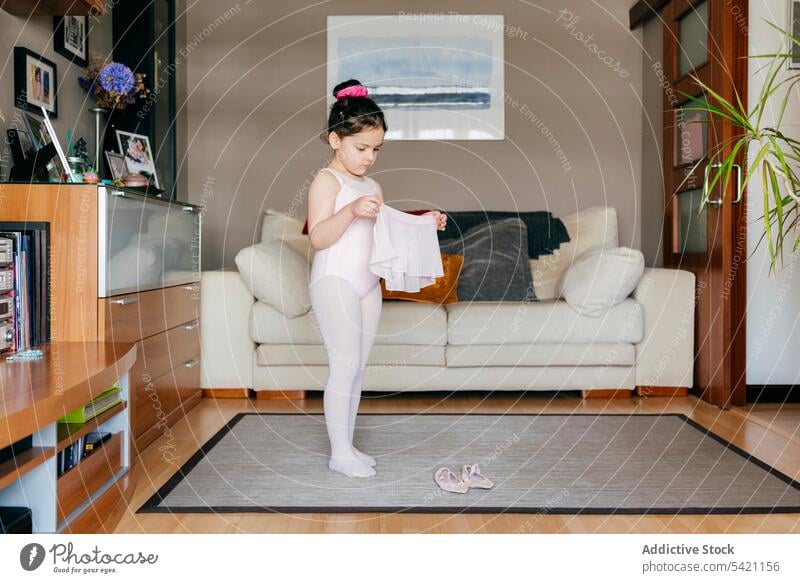 Little ballerina preparing for training at home girl prepare living room cozy put on skirt little kid child shoe leotard tights rehearsal dancer gymnastic grace