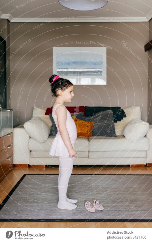 Little ballerina preparing for training at home girl prepare living room cozy put on skirt little kid child shoe leotard tights rehearsal dancer gymnastic grace