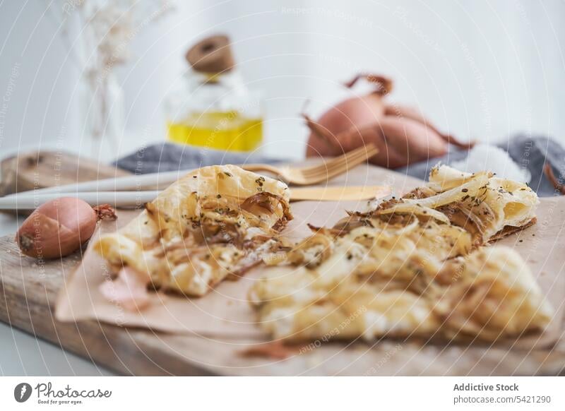 Puff pastry with onion and cream cheese on table puff cutting board dish rustic ingredient food snack delicious fresh meal homemade gourmet prepare cook cuisine