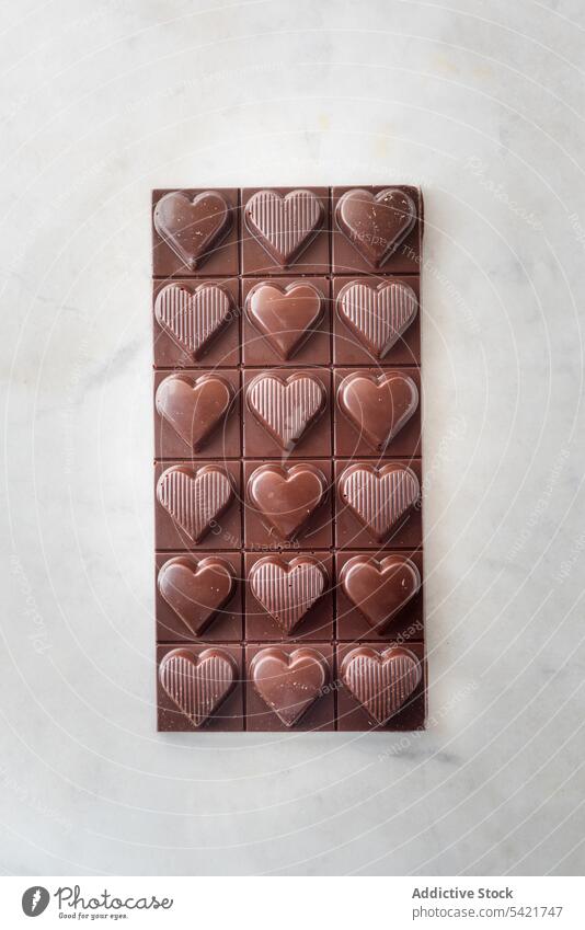 Sweet candies arranged on white table candy sweet dessert delicious shape heart valentine love marble symbol treat composition nut romantic stone tasty