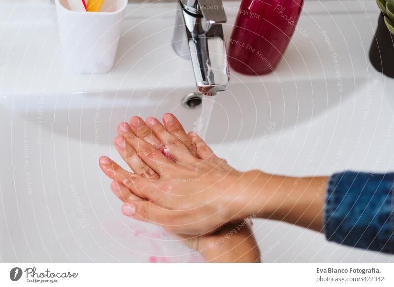 unrecognizable woman washing hands on a sink with soap. Coronavirus covid-19 concept corona virus stay home alcohol hygiene personal sanitary life water female