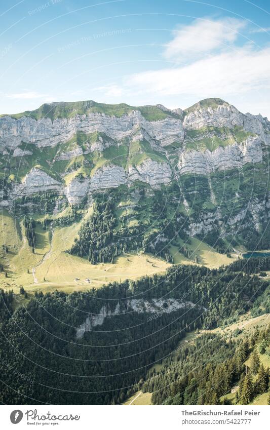 Mountain with forest and cloudy sky Vantage point Panorama (View) Sky Clouds Alpstein hiking country appenzellerland Appenzell mountain stones Rock Walking