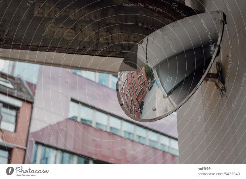 View into the round mirror of an exit in the city traffic mirrors Mirror image Review Circular Reflection Opposite Crossroads Highway ramp (exit) Garage door