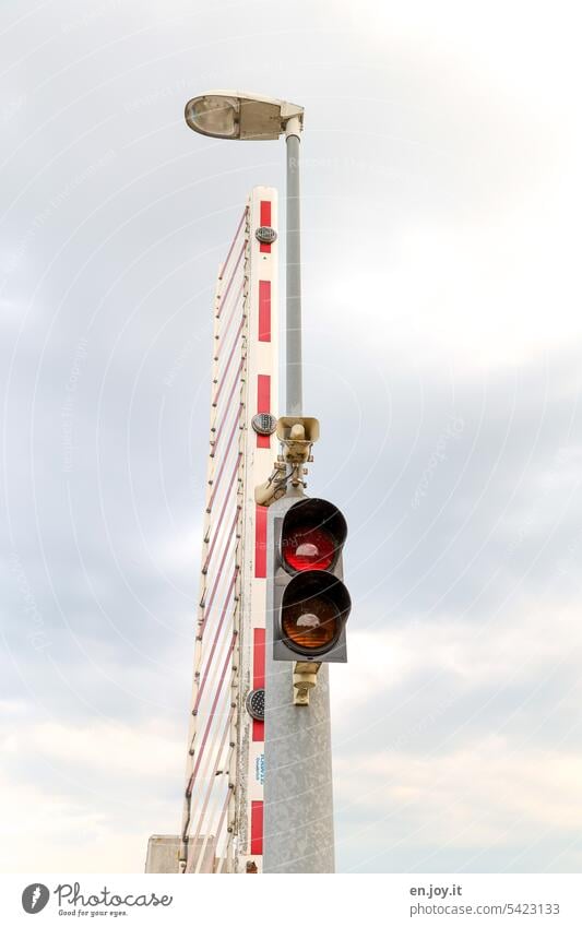 departed | open barrier with traffic light and lantern in front of cloudy sky Control barrier Lantern streetlamp Strapenbeleu Street lighting Traffic light Sky