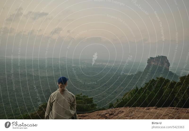 Young woman on the summit of Pidurangala Rock in Sri Lanka pidurangala rock Nature vacation Long distance travel Vantage point Dawn Panorama (View) Sky Mountain