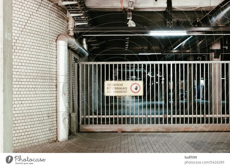 Closed roller shutter of an access road Rolling door Highway ramp (entrance) no access Goal Garage door Highway ramp (exit) Deserted Building Facade Gloomy