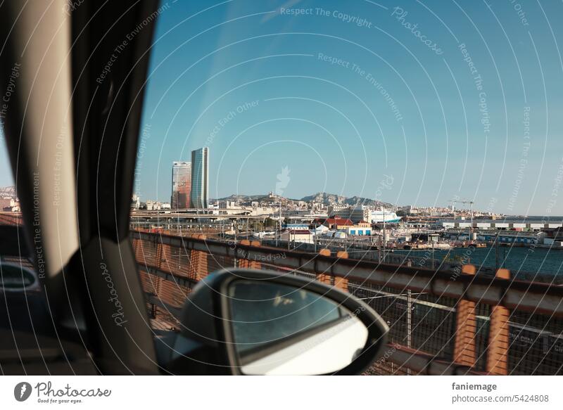 Arrival in Marseille with view out of the car window towards the port and the CMA CGM tower by Zaha Hadid Southern France Provence Planète Mars Town road trip