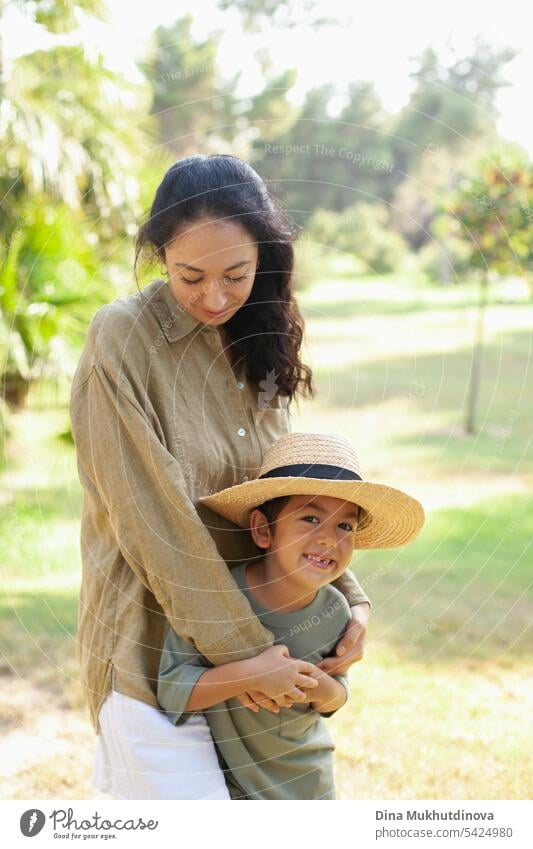 mother and son in the green park in summer on vacation. Happy family. Mother's Day. Motherhood concept. Boy (child) boy kid childhood mother and child nature