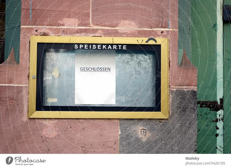 Display of menu with brass frame of a closed restaurant in an old building in the gentrified Braubachstraße in the old town of Frankfurt am Main in Hesse, Germany