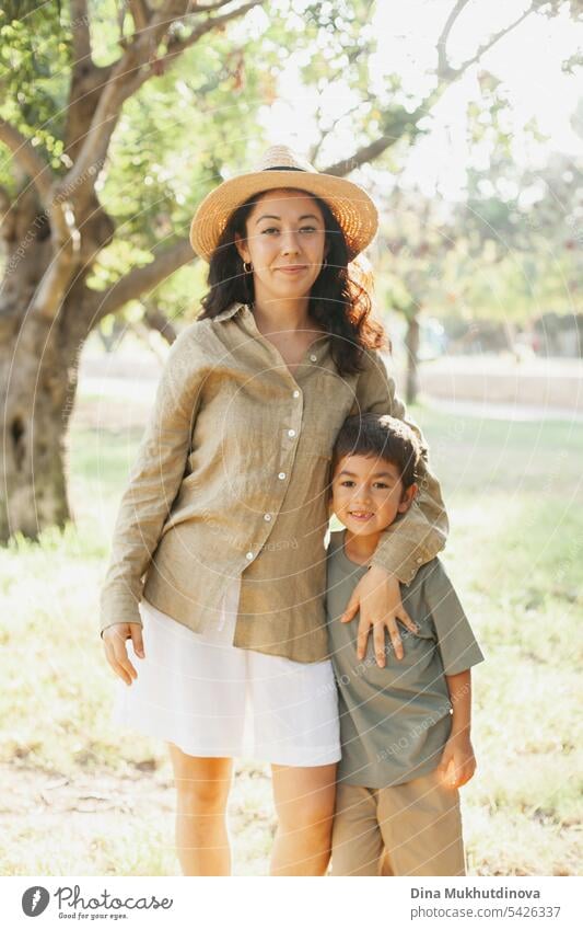 mother and son in the green park in summer on vacation. Happy family. Mother's Day. Motherhood concept. Boy (child) boy kid childhood mother and child nature