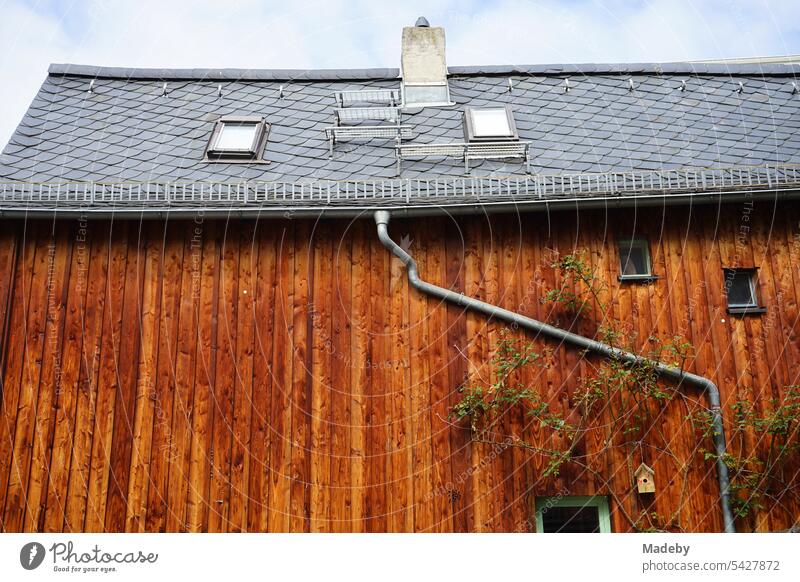 Beautiful wooden facade of a completely restored old building with snow lattice and rain pipe in the Bornheim district of Frankfurt am Main in Hesse