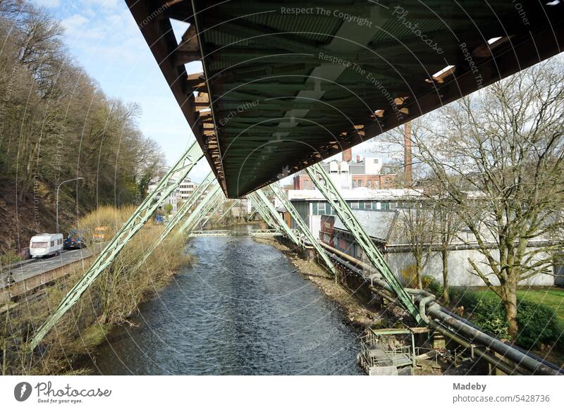 Steel girders of the tracks of the Wuppertal suspension railroad over the river Wupper in the spring sun in the city center of Wuppertal in the Bergisches Land region in North Rhine-Westphalia, Germany