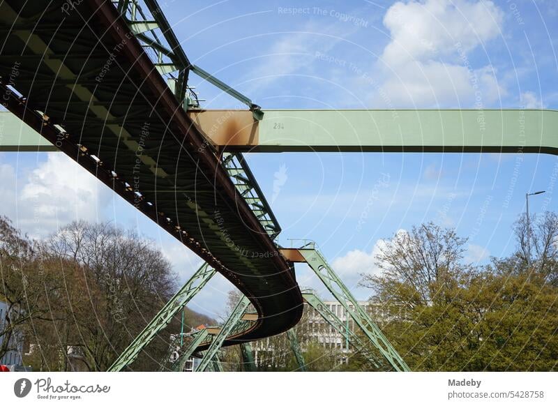 Steel girders of the tracks of the Wuppertal suspension railroad over the river Wupper in the spring sun in the city center of Wuppertal in the Bergisches Land region in North Rhine-Westphalia, Germany