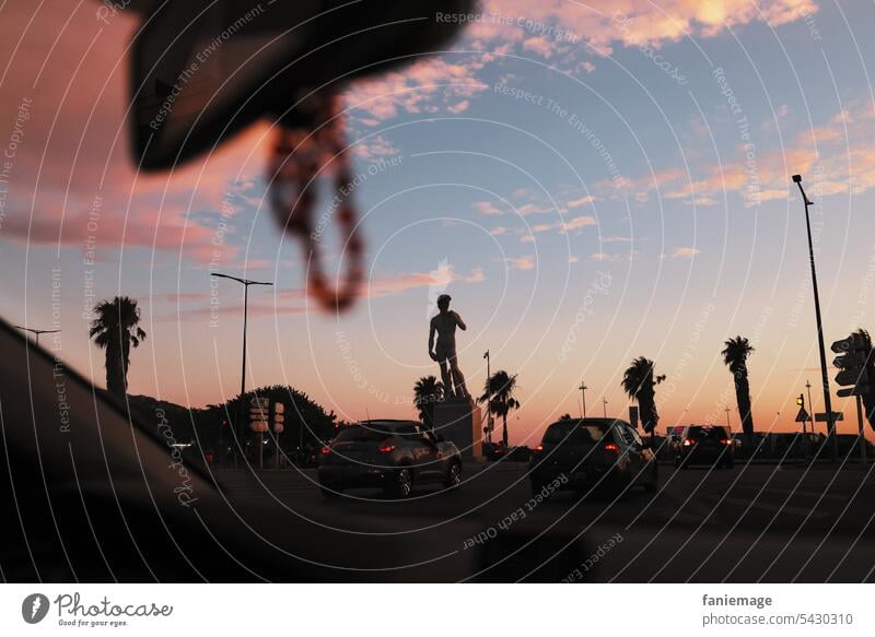 Detour to the Corniche at sunset with arrival at the Statue of David at the Prado Sunset Marseille le David King David road trip car Rear view mirror