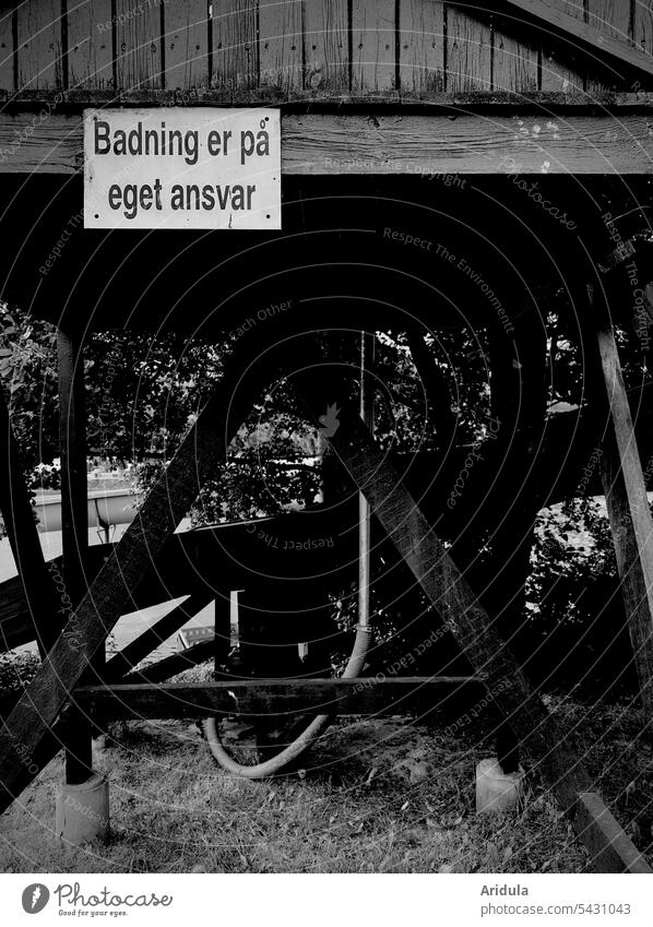 Sign: "badning er på eget ansvar" Signage bathe Tower Swimming & Bathing Water Vacation & Travel Swimming pool Summer Leisure and hobbies b/w Wood Denmark