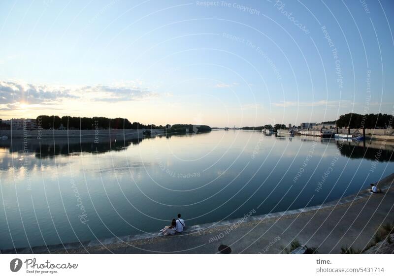 Evening by the river Woman Clouds evening light Moody out Relaxation free time holidays vacation Silhouette Sunset Man Couple Harbour Sit River Rhone reflection