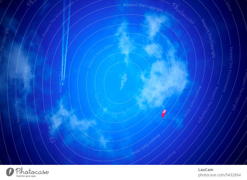 departed | flying objects in different spheres paraglide Paragliding Parachute Airplane condensation strips Flying Flying objects Blue sky Clouds