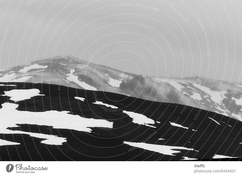 Mountains and hills under cloudy sky in Iceland North Iceland Rock residual snow Snow Nordic mountains Hill hilly iceland trip silent Melancholy fabulous