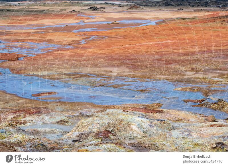 Colors - Hverir geothermal area in the north of iceland in summer geology ground icelandic cracks cooking colorful areal view blue environment europe geologic