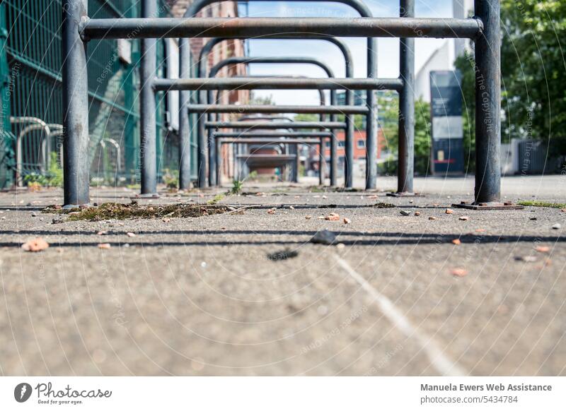 Empty bike racks in the city Bicycle hanger Bicycle rack Bicycle infrastructure Pillar hangers Chain Safety Theft sure chain Perspective Transport turnaround