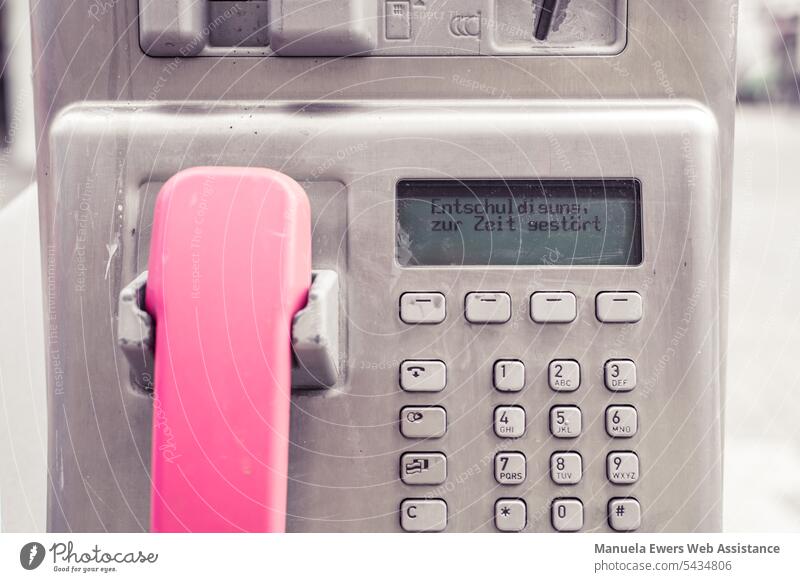 The display of a public pay phone says "Sorry - currently disturbed". Connection Internet Telephone Infrastructure Wlan wifi Analog Digital change Disturbed