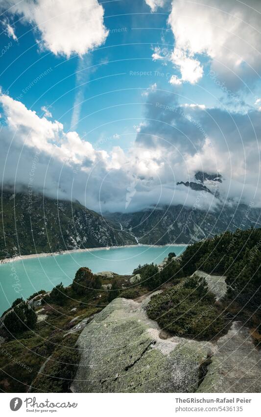 Mountain lake in front of cloud covered mountains Clouds Sky Clouds in the sky Exterior shot Landscape Deserted Colour photo Nature Alps Day Blue Gray rocky