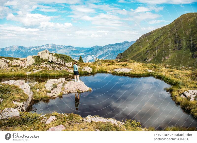 Woman on lake with reflection in water Lake mountain lake Mountain Nature Landscape Exterior shot Colour photo Vacation & Travel Reflection Clouds Alps Trip