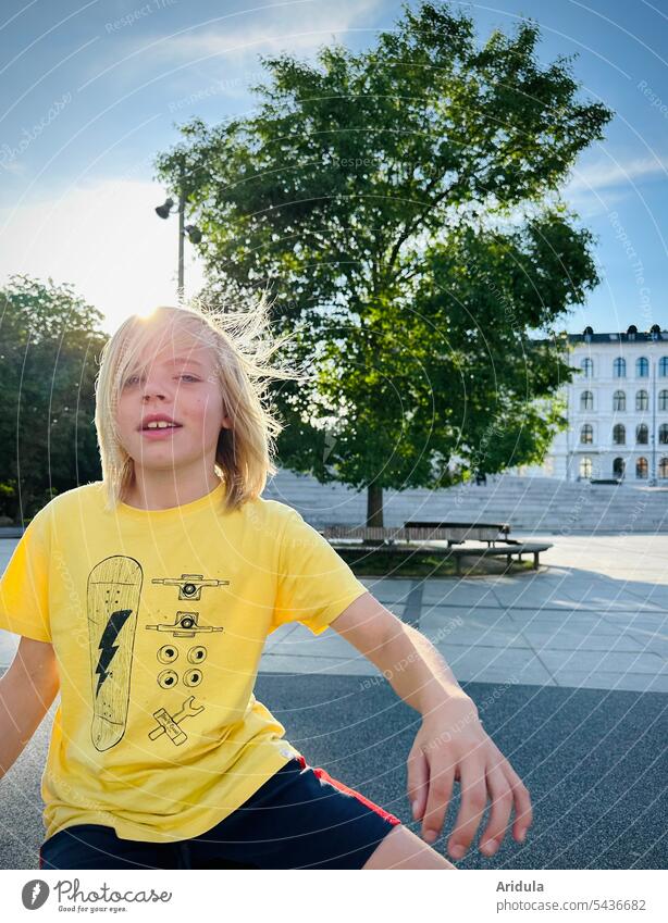 Boy in the wind in the city Boy (child) Child Town hair Wind Movement Yellow Tree Places Human being Youth (Young adults) portrait Hair and hairstyles