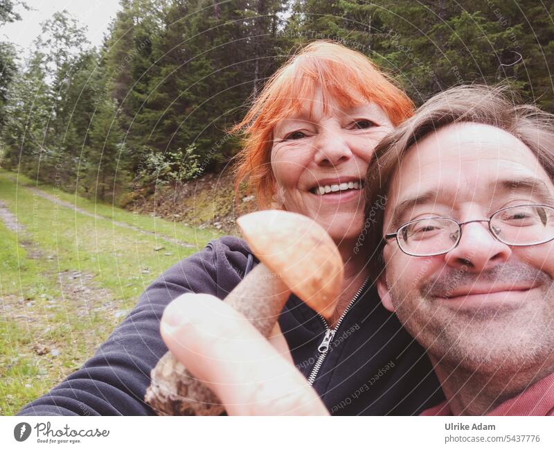 Mushroom season is opened|couple holding birch mushroom in hand Couple Man Woman mushrooms amass Autumn edible mushroom Forest self-catering Norway Edible