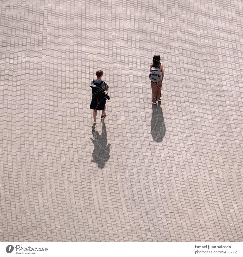 couple walking arround the street visiting Bilbao city, spain person people pedestrian vacation valentine's valentine's day romantic love lovers emotion feeling