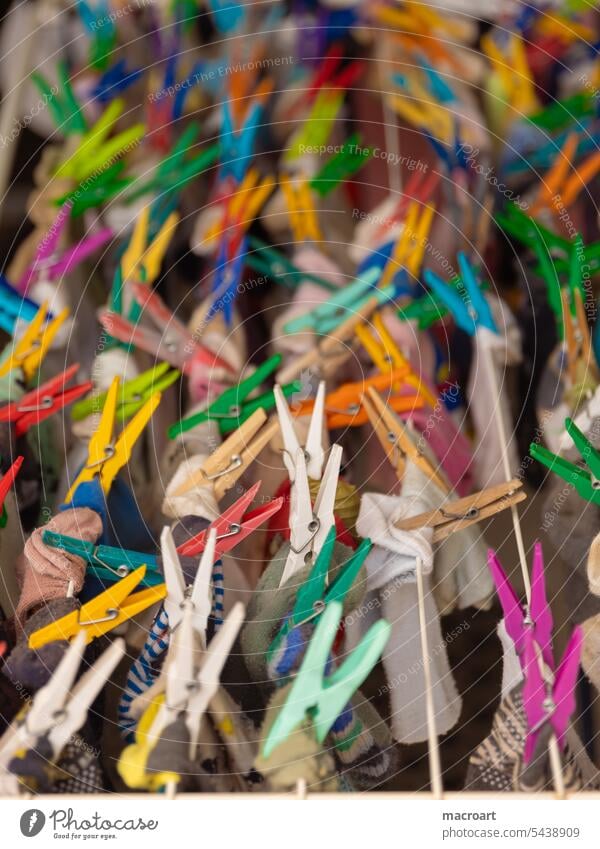 Close up of colorful clothespins on a clothesline variegated Multilateral LGBTQ staples To hold on detail Detail Close-up Yellow Green Love Release