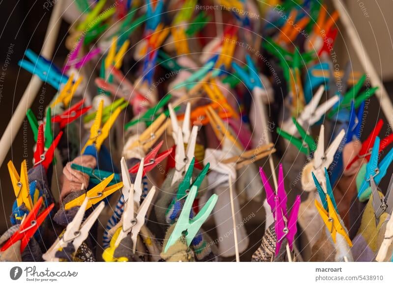 Close up of colorful clothespins on a clothesline variegated Multilateral LGBTQ staples To hold on detail Detail Close-up Yellow Green Love Release