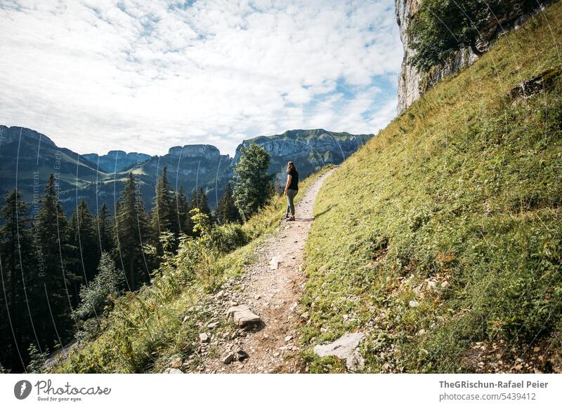 Woman on hiking trail in the Alpstein hike Switzerland Mountain mountains Nature Landscape Tourism Walking Hiking Exterior shot Sky tourist region plants