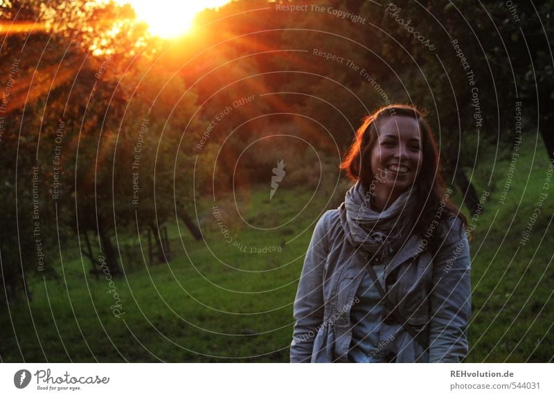 Young woman laughing in the evening sun Feminine Youth (Young adults) Woman Adults 1 Human being 18 - 30 years Environment Nature Plant Sun Sunrise Sunset