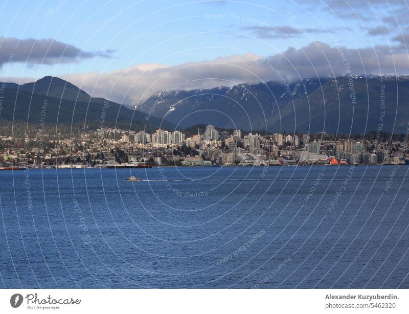 North Vancouver and Burrard Inlet seen from downtown Vancouver, British Columbia, Canada BC travel ocean sea travel mountains